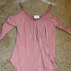 Strap over the shoulder light pink shirt